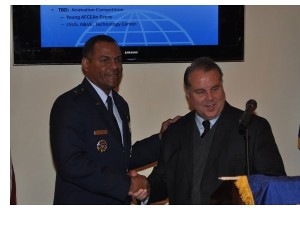 Brig. Gen. Everett Thomas, USAF (l), vice commander, Headquarters Air Force Global Strike Command, Barksdale Air Force Base, accepts a speakerýs award from Kevin Smith, chapter member, in April.